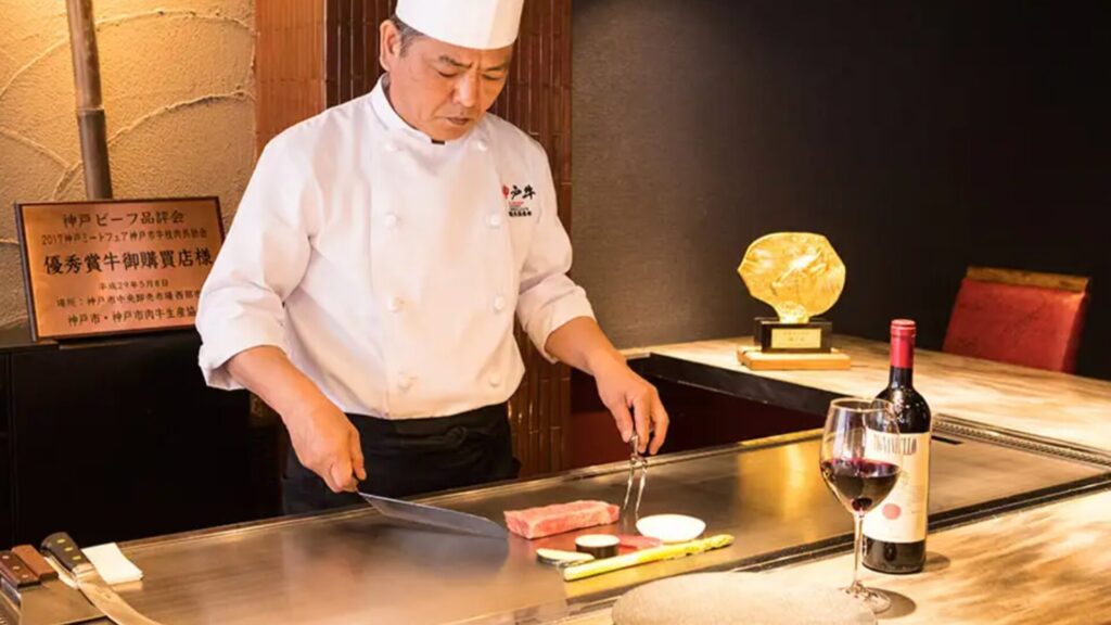 A chef is cooking at the Kobe Beef Wanomiya Dotonbori